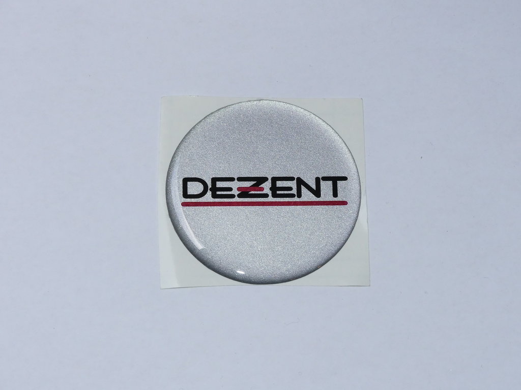 1 DEZENT Klebe-Logo silber 60 mm